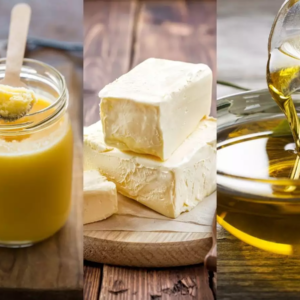 Oil , Ghee and butter in jars on a counter top