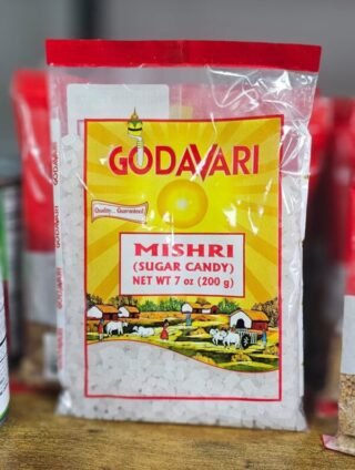 Godavari Mishri sugar candy in a clear container, showcasing its crystalline texture.