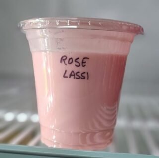 A refreshing glass of Rose Lassi made with roses and yogurt