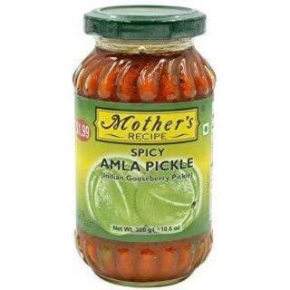 Amla Pickle from Mothers Recipe in a jar, showcasing Indian Gooseberries and spices.